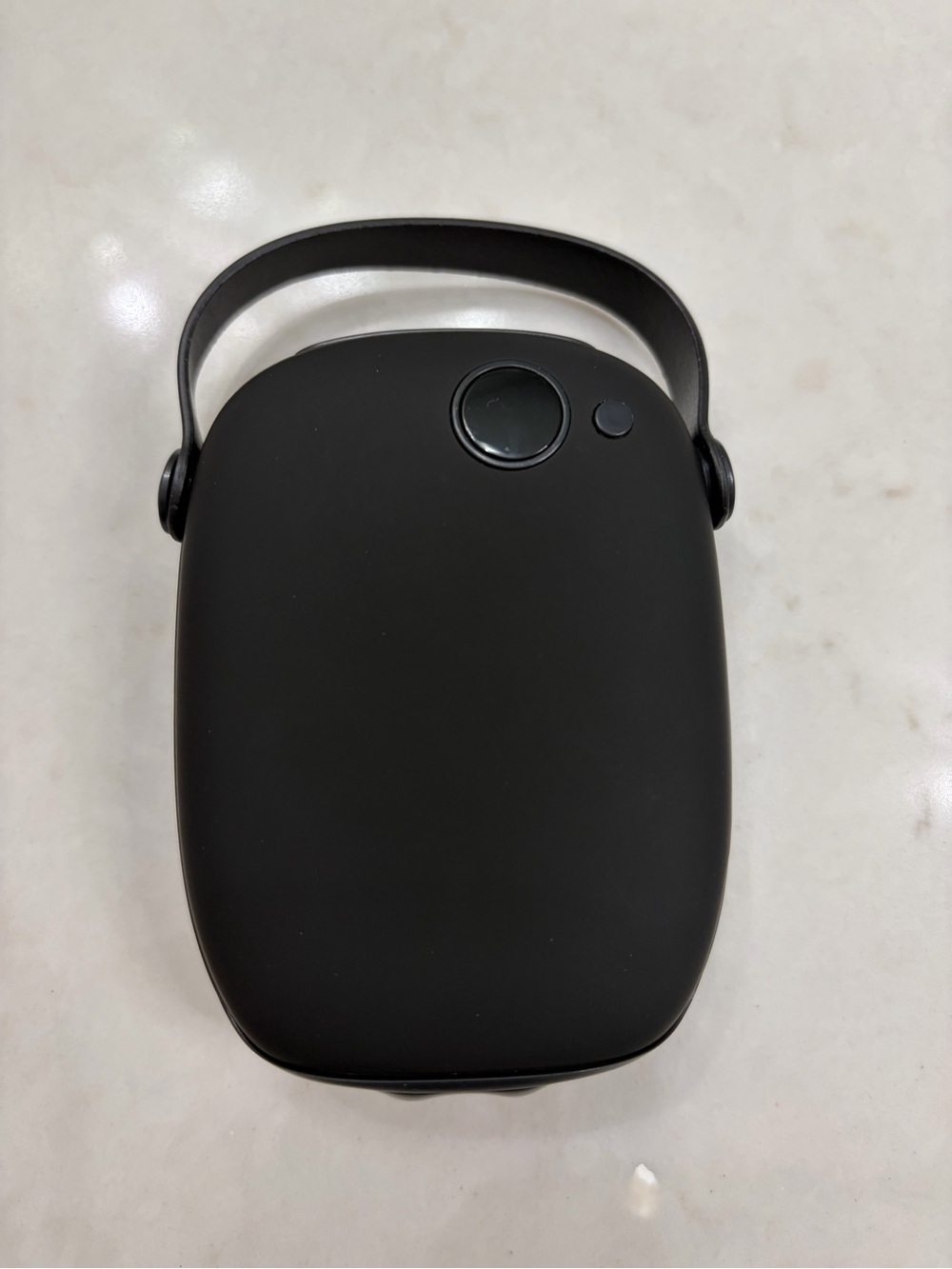 Black hand warmer and power bank with carry handle